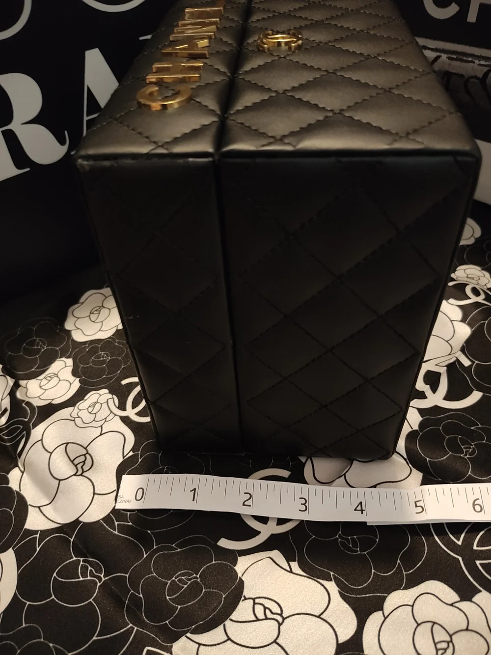 Black Quilted Jewelry Case with Gold Logo Accents And Mirror